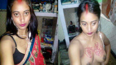 Indian girl with headphones in ears exposes XXX boobies with sex text on