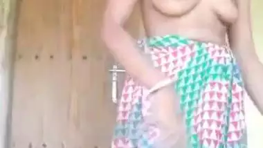 Solo Desi wife striptease and masturbation in self-made XXX video
