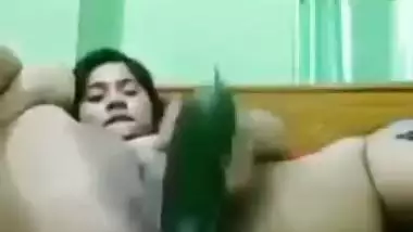 Indian girl masturbating with cucumber