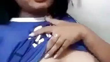 Beautiful desi girl lifting top to reveal sexy boobs