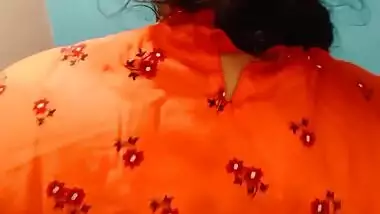 Hard penis helps the excited Desi in orange dress satisfy XXX slit