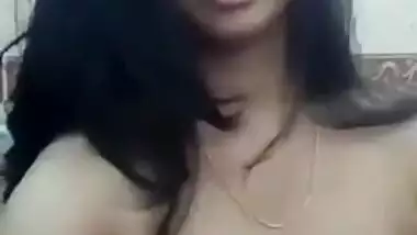 Indian whore lays bare XXX boobs with dark nipples squeezing them
