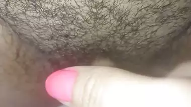 She fucks her pussy with huge and long fingers