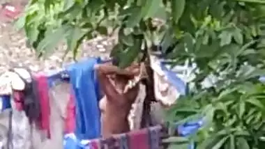 Indian girl bathing outdoor