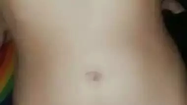 Nude girl puts henna on her naked body during a video call sex