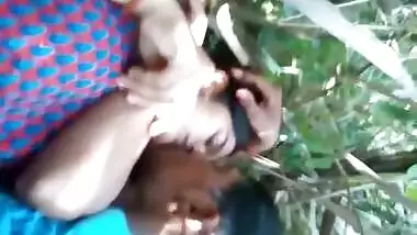 Loving Indian couple kisses lying on grass before porn action