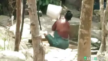 Indian busty aunty taking bath outdoor full nude, caught hidden cam