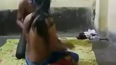 Half-naked young Indian woman allows man to come and touch XXX tits