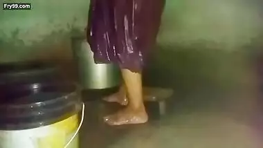 Indian aunty bathing in village home