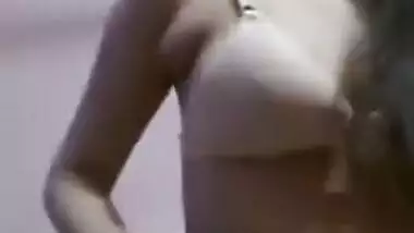 Woman shows XXX boobs before putting a sex bra on in front of Desi cam