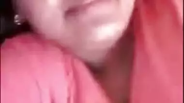 Indian chick in a red robe bares her natural XXX breasts to the sex fan