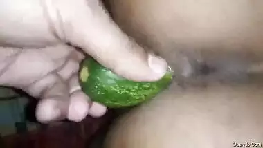 Hubby inserting huge cucumber in his desi wife pussy with wife is moaning