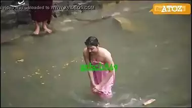 Indian village girls having a public bath