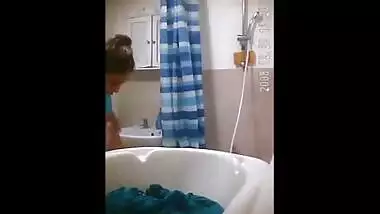 Escort girl bathing in nature's garb for porn video