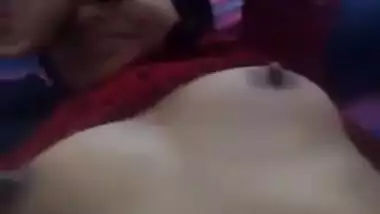 Well-mannered Indian slut lies in bed with naked tits waiting for man