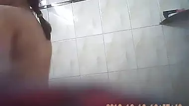 Sexy girl in bathroom exposing assets