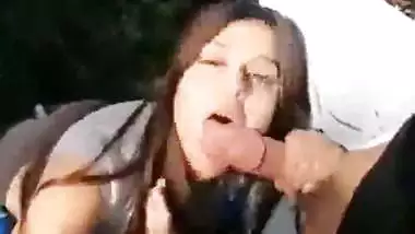 Young College Babe Sucking and Biting Her Lovers Penis in a Park