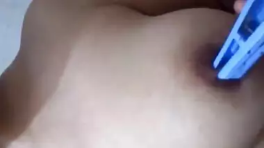Indian girl exposing and playing with her boobies