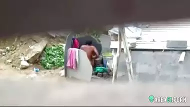 Neighbor on a hidden camera caught aunt taking a bath on the outdoor naked