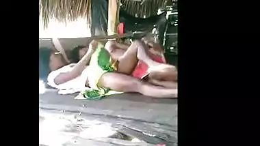 Young couple enjoy outdoor sex in a tent house on the beach