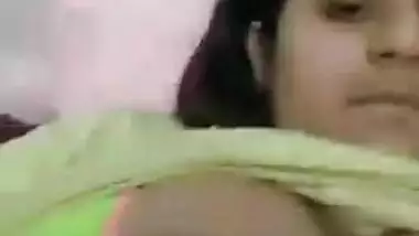 Indian girl pulls T-shirt up to expose her XXX titties and nipples