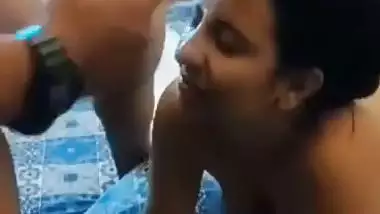 A girl gets cum on her face in an Indian threesome blue film