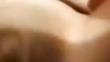 Amateur Desi girl spreads broken pussy lips and fucks herself in bed