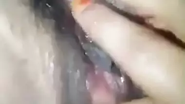 Rubbing her wet pussy