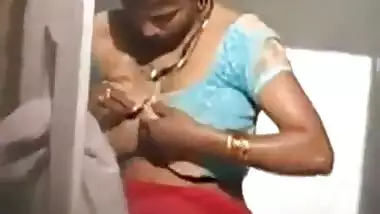 Busty Indian maid having a bath outside home