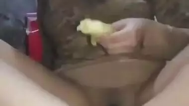 Cute Paki girl masturbating with banana