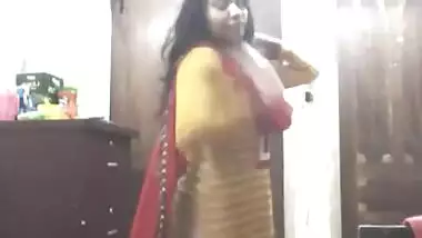 bengali girl in shalwar suit striping and trying dresses