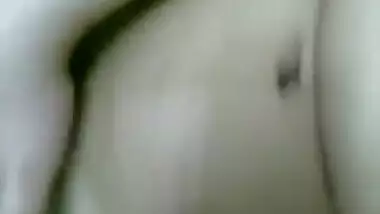 Hairy chick plays with pussy.