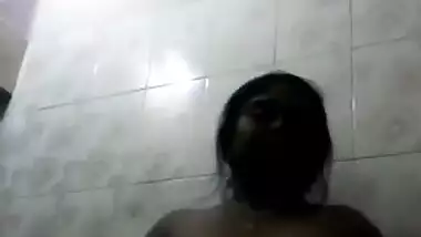 Pretty Desi aunty whips out her natural XXX melons in the bathroom