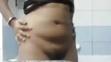 Modest Desi teen finds courage to show perky XXX tits in bathroom