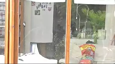 NRI house wife cleaning glass and showing naked figure